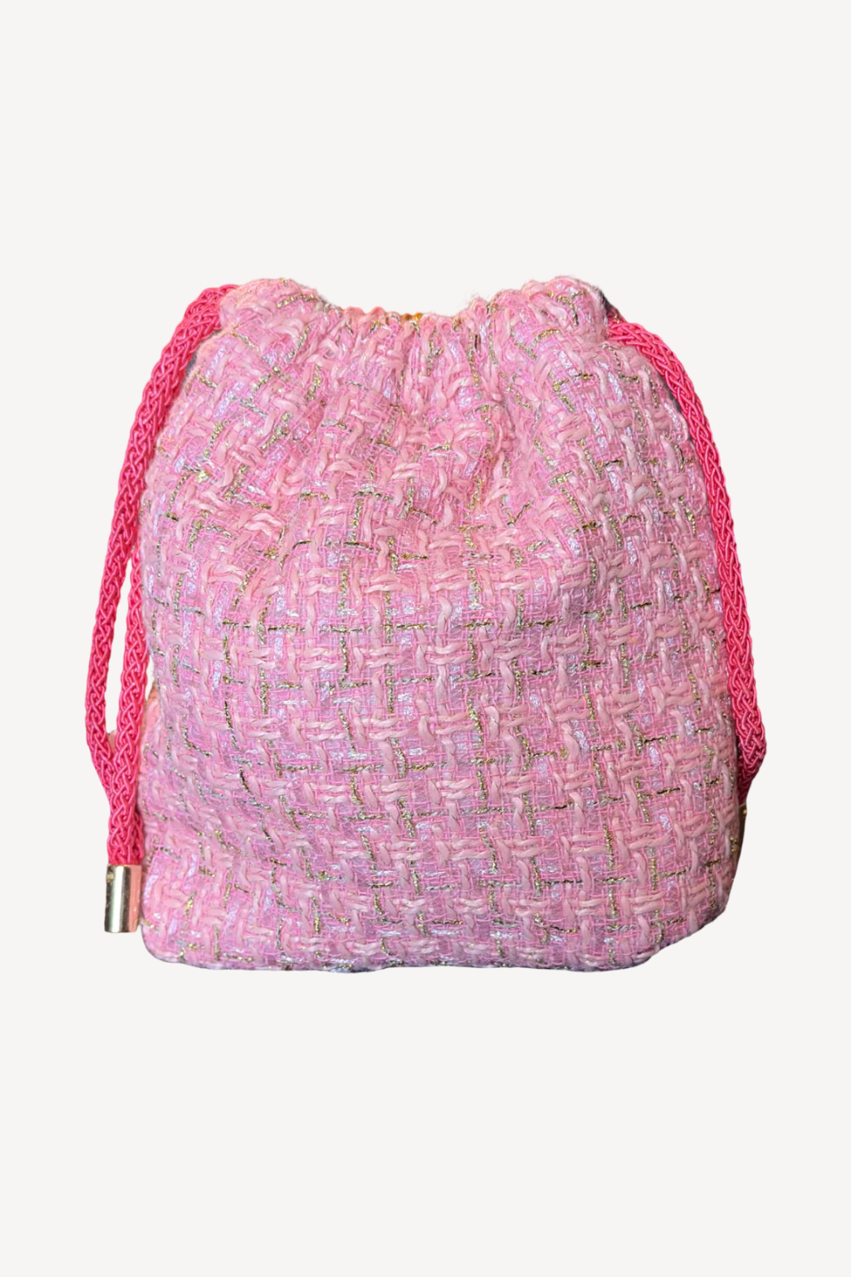 Pink drawstring bag with a textured pattern on a white background