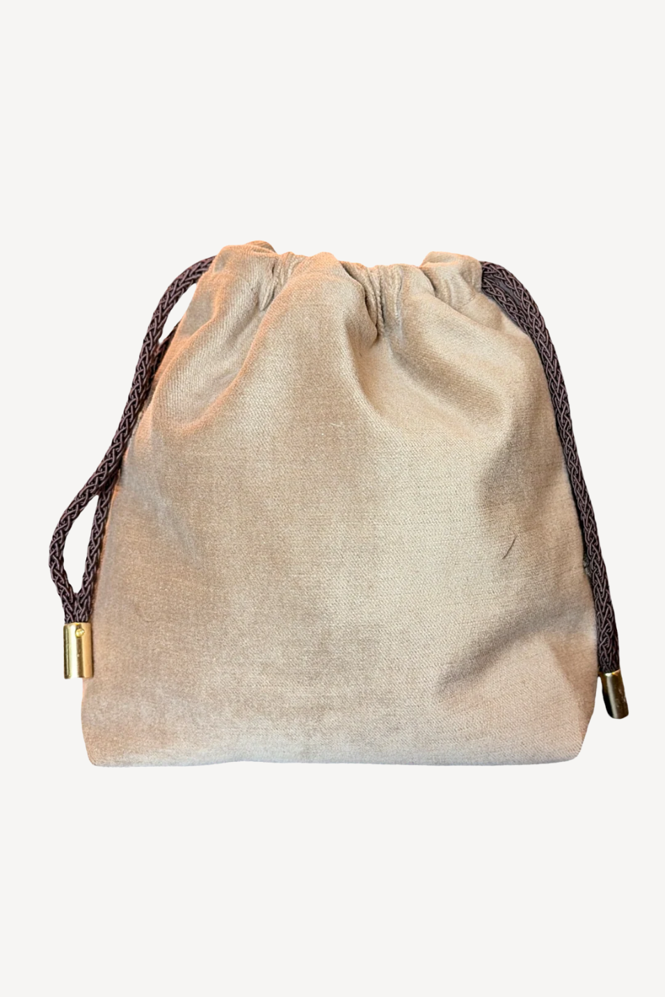 Beige drawstring bag with brass drawstring on a white background