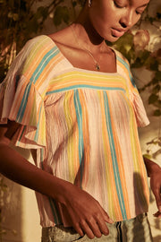 Image of model wearing the SAYLOR Arbor Top in Sherbet, standing outside, front view