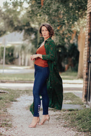 Model wearing L'agence Piper jean with cami and duster under a tree