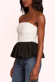 Image of model wearing Amanda Uprichard Gaston top in black and white