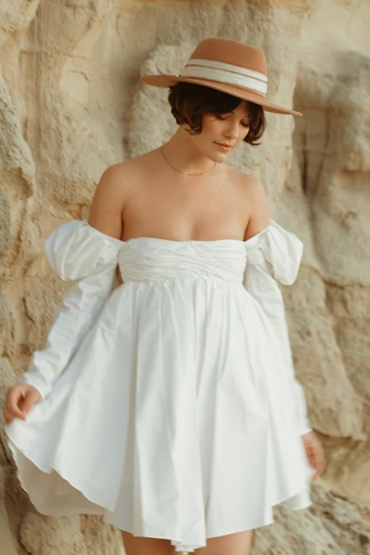 Image of model wearing Freya Almond hat in camel