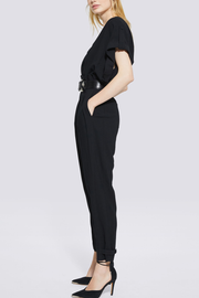 Image of model wearing IRO Caspian jumpsuit in black