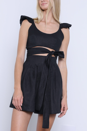 Image of model wearing Karina Grimaldi Sage mini skirt in black