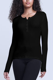 Image of model wearing L'agence Faith henley in black