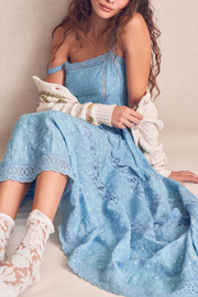 Image of model wearing LOVESHACKFANCY Camisha dress in blue bonnet