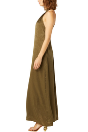 Image of model wearing Misa Zahra dress in olive satin