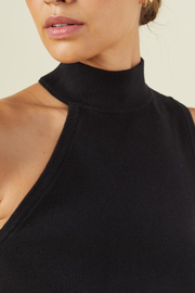 Image of model wearing Monrow supersoft sweater knit asymmetric mock neck tank in black