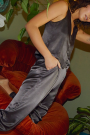 Image of model wearing Nation Ltd Camden snap cuff pant in liquid metal